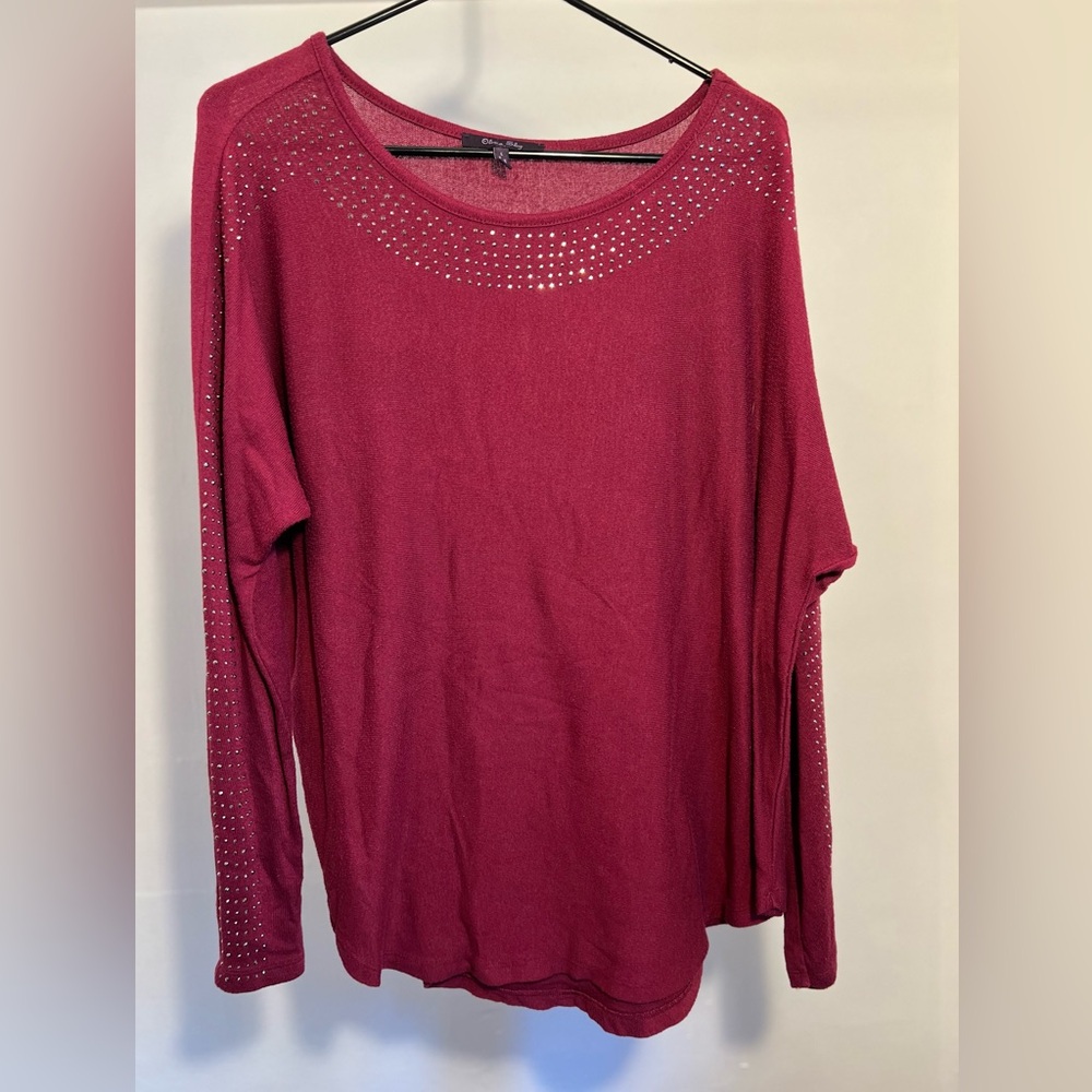 Maroon colored long-sleeved blouse, size large.